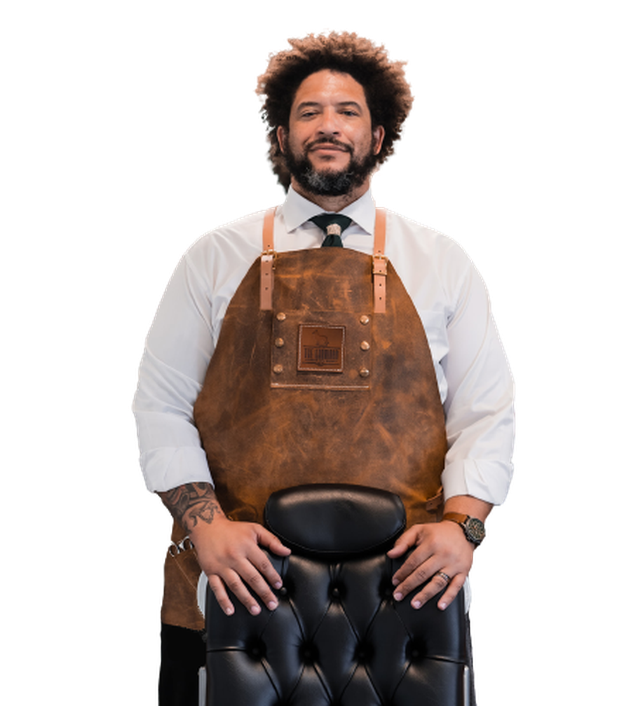 Elliott Chester standing behind a barber chair